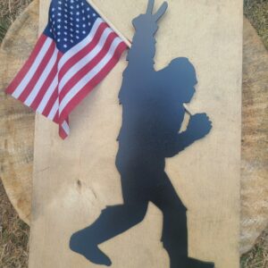 Bigfoot holding an American flag showing the peace sign.